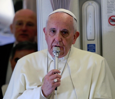 Pope Francis on plane from Manilla